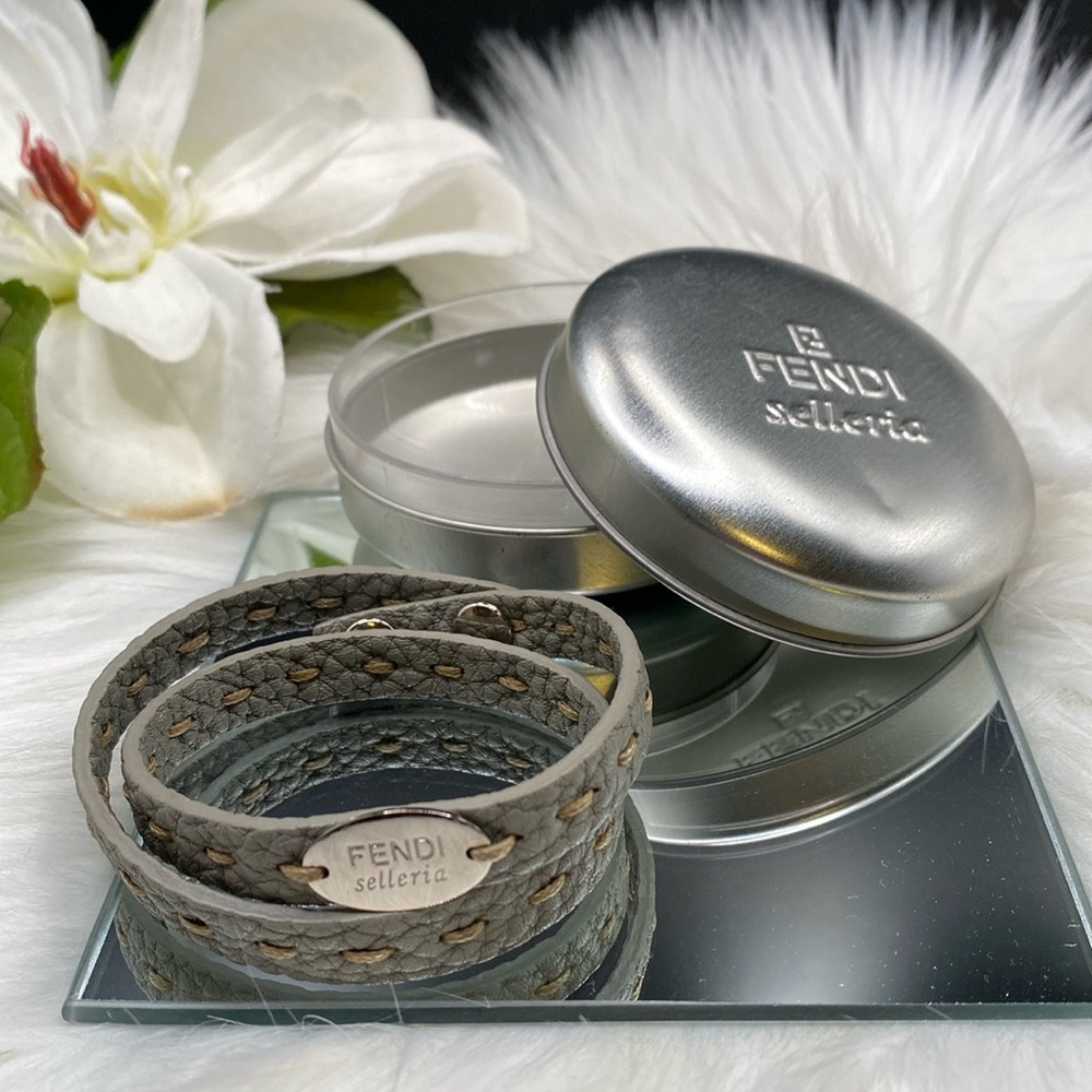 FENDI SELLERIA LEATHER and SilverTone Wrap bracelet. Snap closure. Tin included.